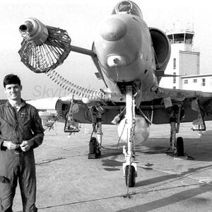 Blade standing beside a VMA-131 A-4E fitted with the basket