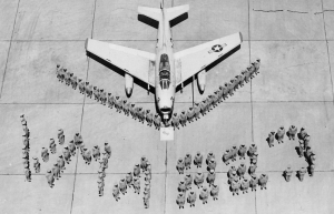 FJ-4B Fury WP-3 and squadron personnel spelling out VMA-223.